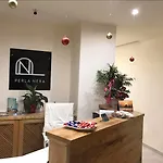 بيرلا نيرا سويتس شقة *
